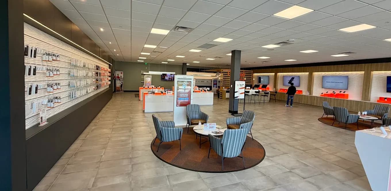 Wide view of the completed Consumer Cellular Fort Myers consultation seating and accessory wall