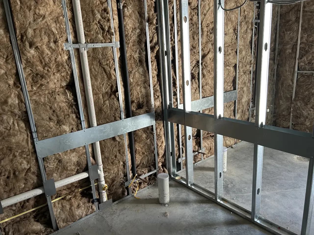 Interior metal stud partitions and wall insulation during the Consumer Cellular Fort Myers tenant improvement