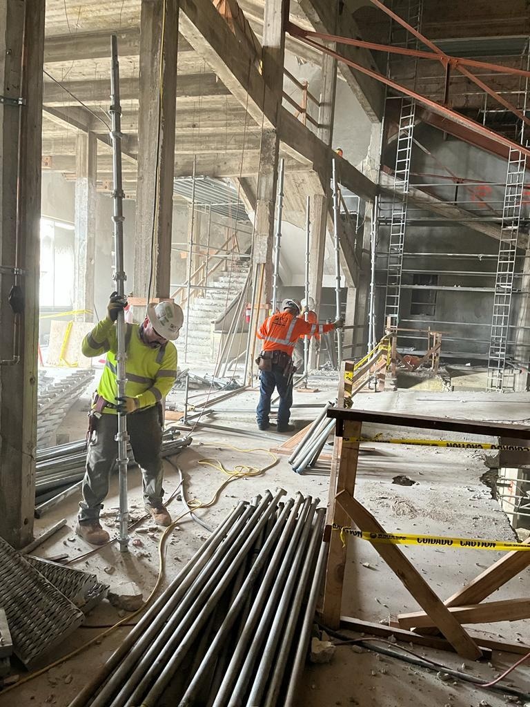 Commercial renovation with temporary shoring and structural retrofit work in progress