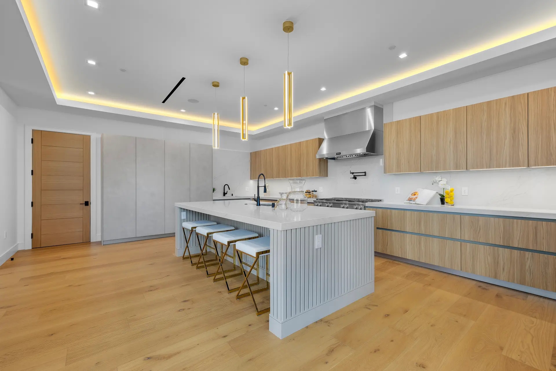 Completed custom kitchen with oversized island in a DWD Builders luxury home in Encino, California