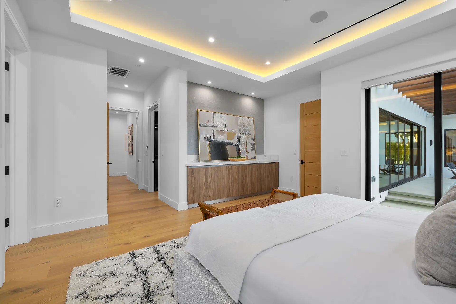 Bedroom with courtyard access in a DWD Builders luxury home in Encino, California