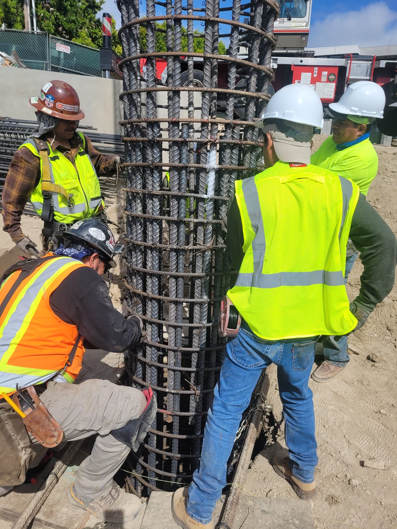 DWD Builders crew setting caisson rebar cage — Encino hillside project 2026