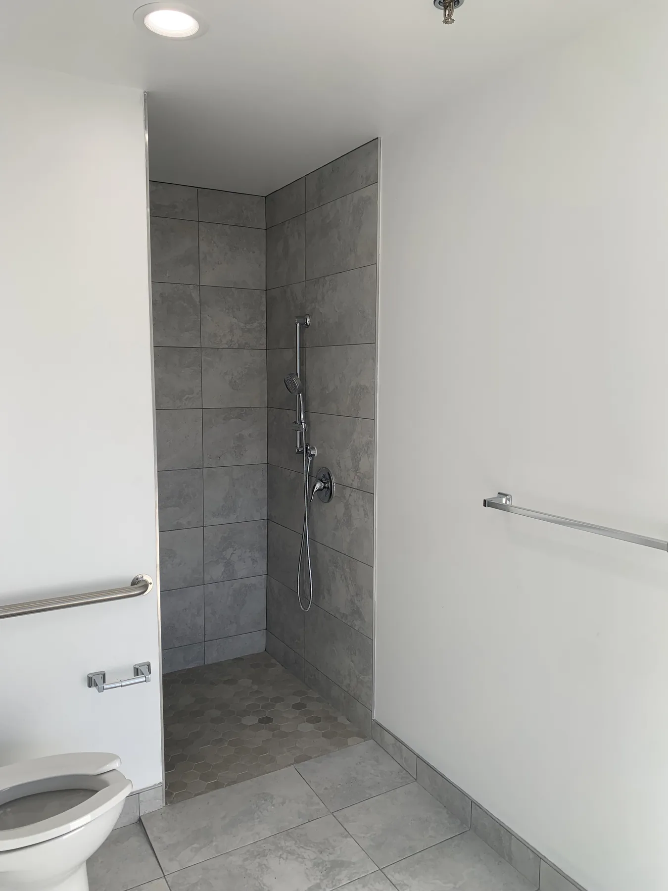 Accessible Shower — Tile, Grab Bars and Handheld Fixture